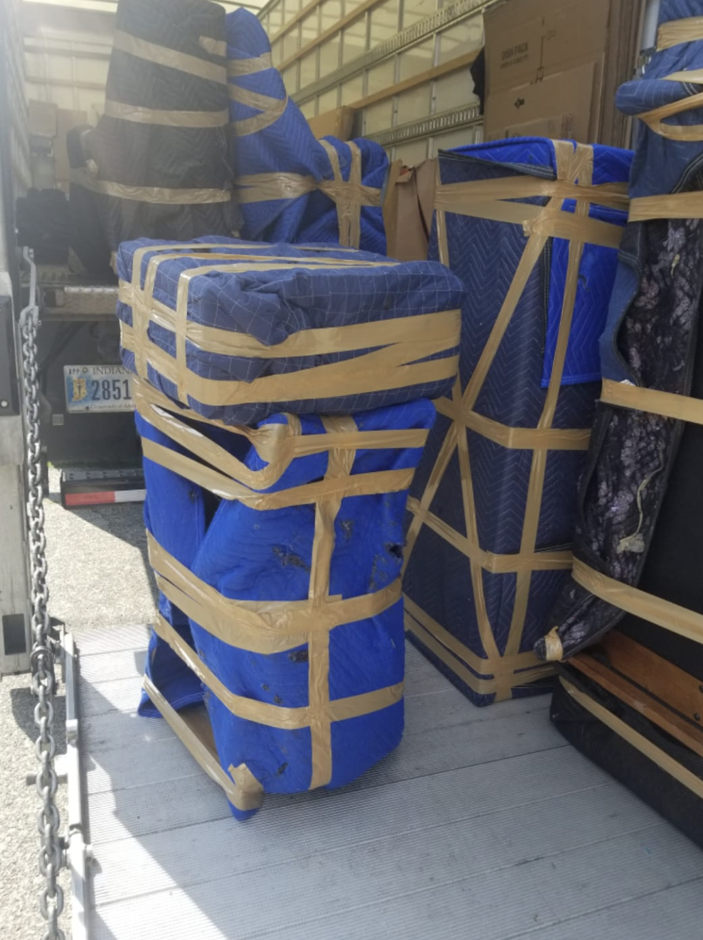 Protected furniture stacked and secured inside the moving truck